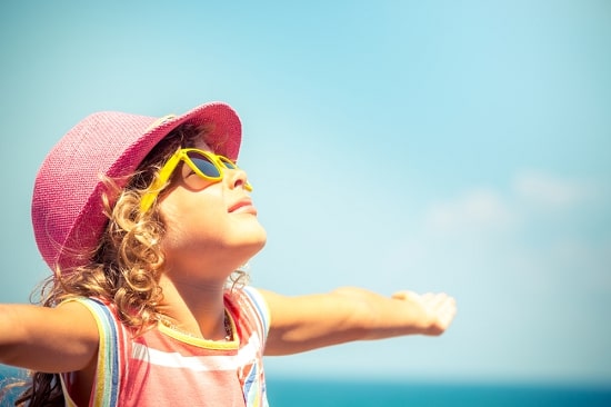 girl-taking-vitamin-D-in-sunlight-summer-fun-ideas