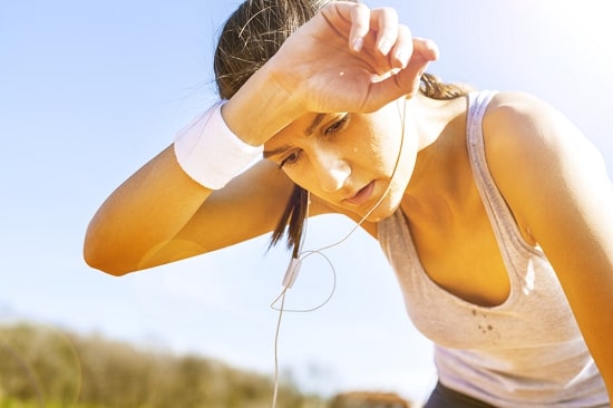 woman-sweating-how-summers-can-be-fun
